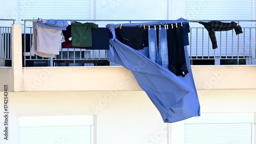 variety of clothes drying on a windy day 
