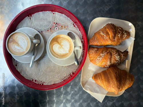 colazione con cappuccino e croissants, breakfast with cappuccino and croissants