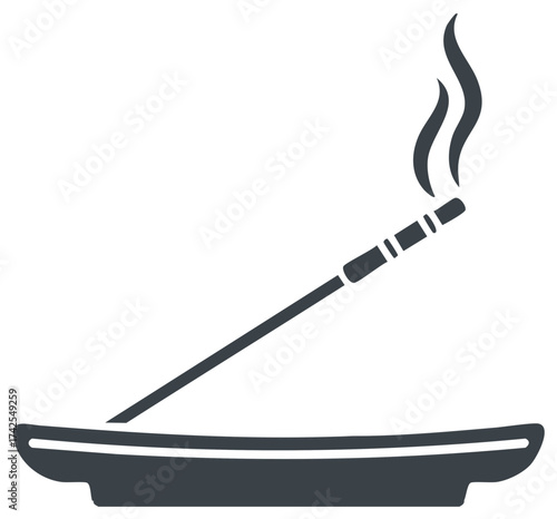 Incense stick burning, smoke rising from a ceramic bowl, meditation and relaxation concept.