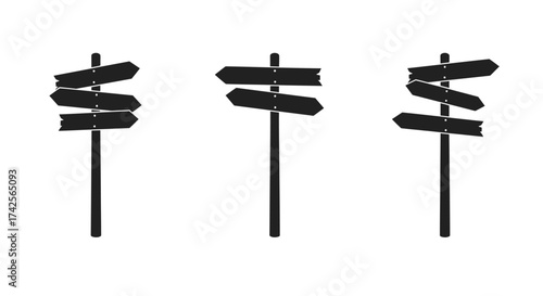 A collection of simple black wooden direction sign posts isolated on white