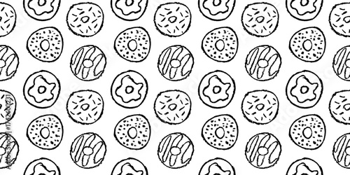 Seamless black and white doodle pattern of hand drawn donuts with texture. Sketchy sweet pattern with donuts on white background.