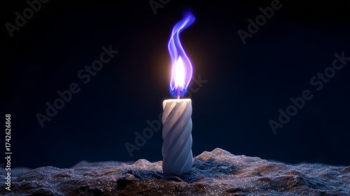 Twisted candle with blue flame on glittering surface at night