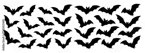 A row of bats are shown in black and white. The bats are arranged in a pattern, with some overlapping. Vector. Silhouette illustration.