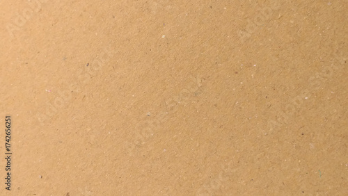Old Kraft paper texture box craft stripes pattern. top view.
Abstract brown recycled paper background. 