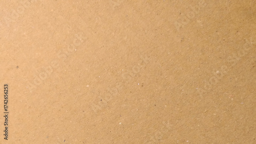 Old Kraft paper texture box craft stripes pattern. top view.
Abstract brown recycled paper background. 