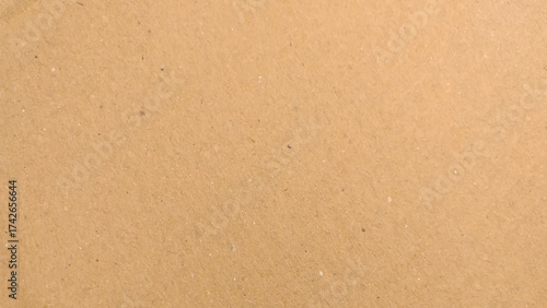 Old Kraft paper texture box craft stripes pattern. top view.
Abstract brown recycled paper background. 