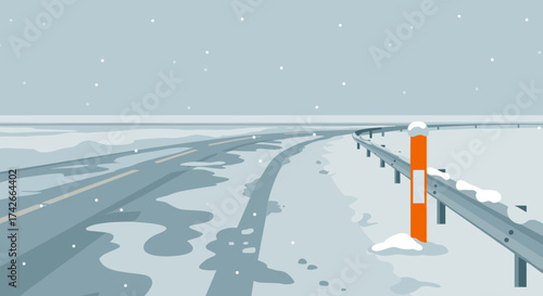 Snowy road curve with orange marker and railings under falling snow