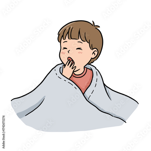 Tired young boy yawning while wrapped in a cozy blanket  