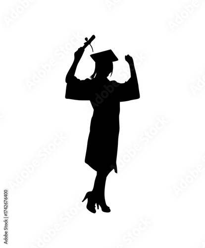 Silhouette of a triumphant female graduate in cap and gown holding diploma and raising arms in celebration