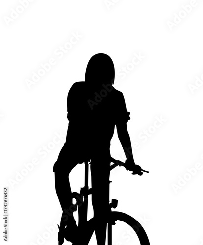 Silhouette of a person on a bicycle against a bright white background