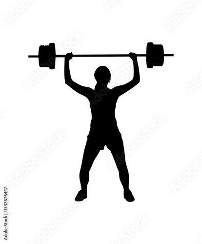 Silhouette of a person lifting a heavy barbell overhead during a weightlifting exercise