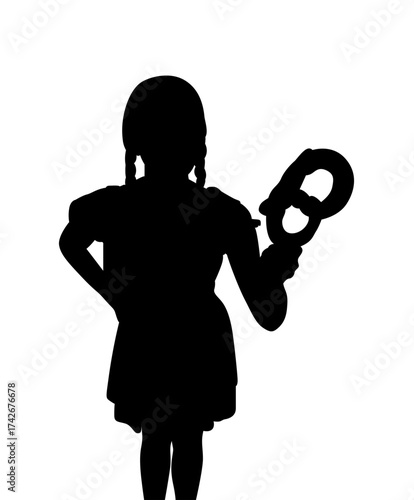 Silhouette of a young girl with pigtails holding a pretzel against a white background