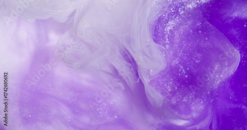 Sparkling paint. Glitter cloud. Defocused purple white colorful shimmer splash acrylic texture on abstract creative bokeh background.