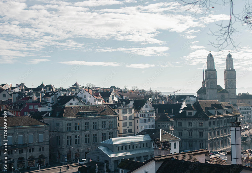 Naklejka premium Grossmünster Church towers rising above Zurich old town, Switzerland