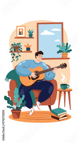 Man playing guitar while sitting in a comfy armchair by the window.