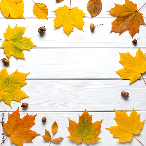 Fototapeta Naklejka Na Ścianę i Meble -  Autumn leaves border on white wood