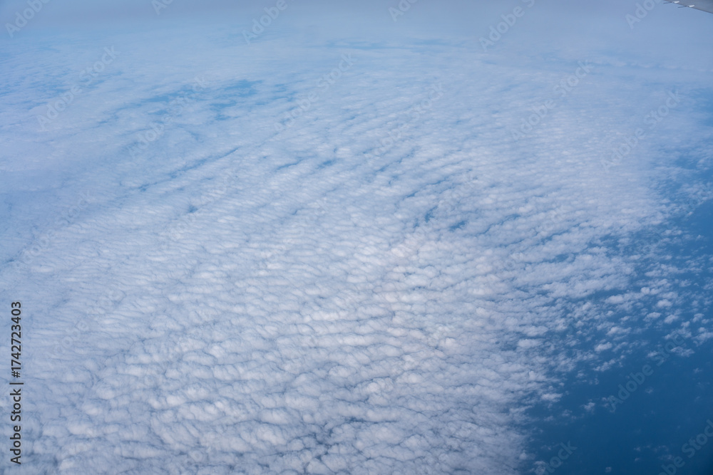 Obraz premium Blue sky with white clouds, flying above cloudy sky texture pattern, cloudscape blurred light