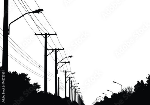 Silhouette utility poles with streetlights, power lines, symmetrical road perspective, tree silhouettes, vanishing point depth, urban electricity infrastructure, telecommunications network system
