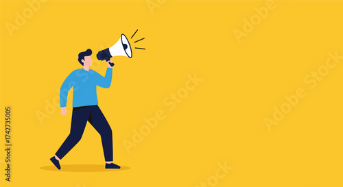 A man in a blue shirt walks while holding a megaphone and announcing something important.