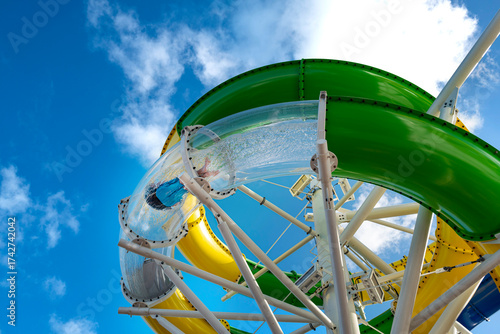 Tourist on the tube slide on the cruise ship. Bahamas, 2022