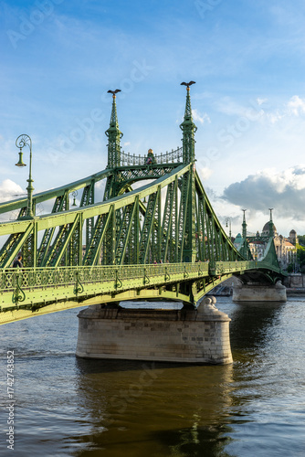 The beautiful green Liberty Bridge (or Freedom Bridge) in Budapest, Hungary, connects Buda and Pest across the Danube river. 