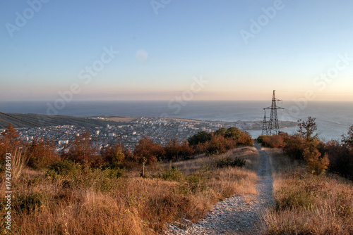 A view from a mountainside on an autumn day. A view from the observation deck of the sea and the city of Gelendzhik. Autumn in the mountains by the Black Sea.