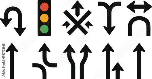Collection of black traffic arrows and a traffic light with red yellow green lights direction turn