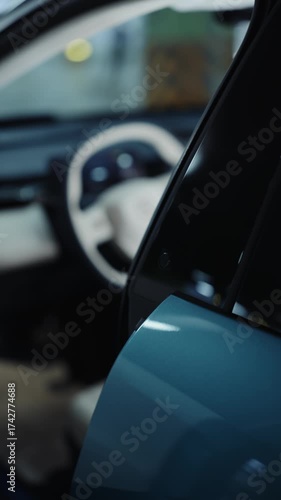 Man opening electric car door using touch sensor
