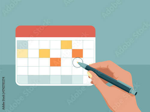 Hand marking a date on a calendar with a pen, planning and scheduling