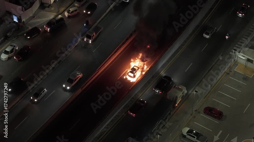 Car burning in the middle of the street 