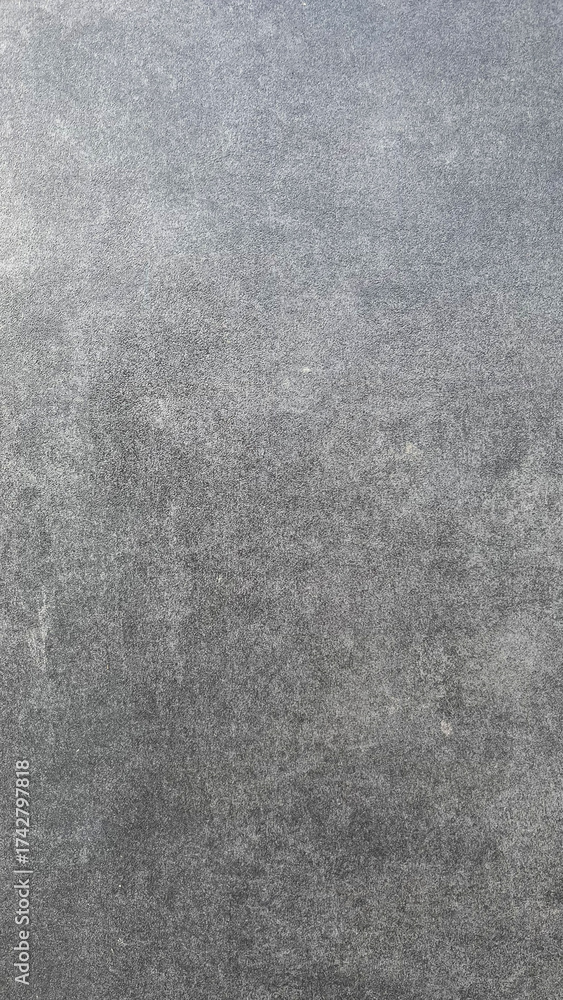 Fototapeta premium Textured gray surface showing subtle patterns in natural stone material from a quarry
