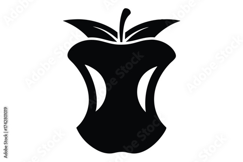 A stark black core of a partially eaten apple reveals its unique silhouette