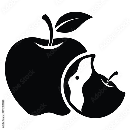 Black apple with stem and leaf alongside a separate bitten slice, isolated