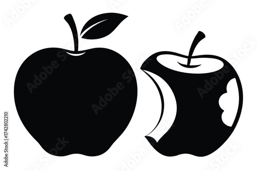 Two black apples include one whole with leaf and one bitten on white
