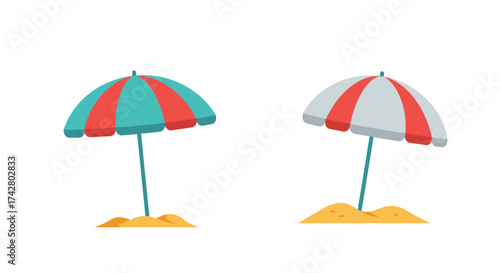 Two colorful beach umbrellas standing in the sand summer vacation vibes
