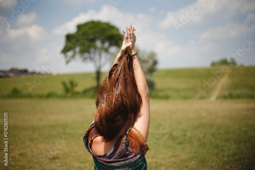 Women playing with her hair on a hill in Detroit Michigan 