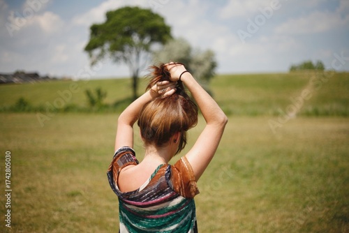 Women playing with her hair on a hill in Detroit Michigan 