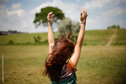 Women playing with her hair on a hill in Detroit Michigan 