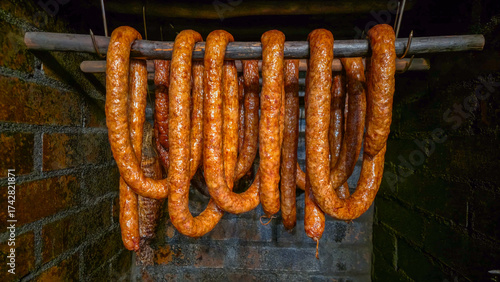 Smoking sausages in a traditional smokehouse