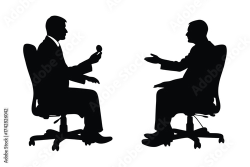 Two silhouette men converse while seated in office chairs, one showing something