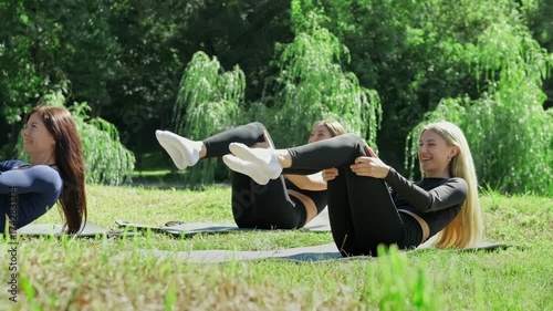 Sport in green park. Female training outdoors. Sport concept. Exercising outdoors together.4K, UHD