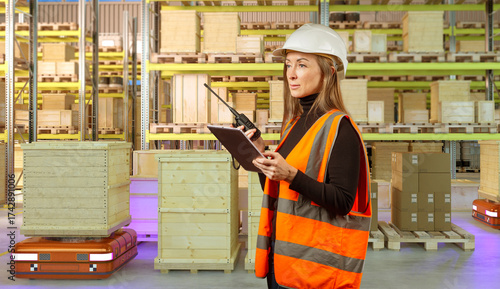 Female worker in hard hat a...