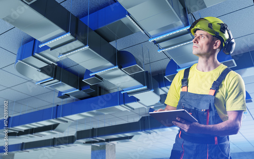 Technician in helmet with t...
