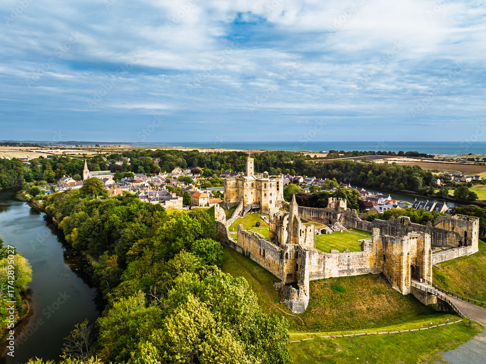 Obraz premium Warkworth Castle over River Coquet from a drone, Warkworth, Northumberland, England
