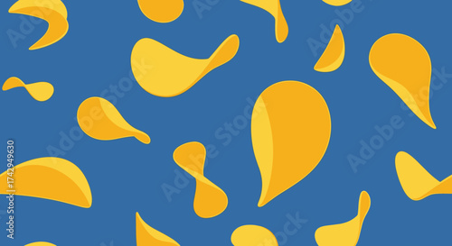 Crispy golden potato chips scattered on a blue background a delicious snack.