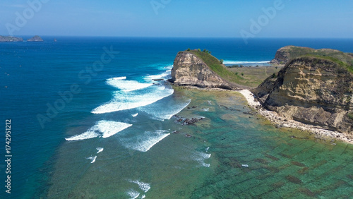 Aerial View of Tropical Lombok Coastline, Indonesia. Ocean Cliffs and Waves. Mawun beach Lobok.