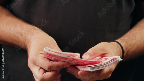 Person holding Chinese Yuan banknotes 4k video