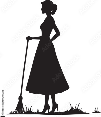 Black silhouette woman in dress holding broom on grass