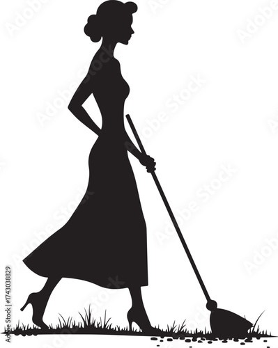 Silhouette of woman in vintage dress sweeping grass
