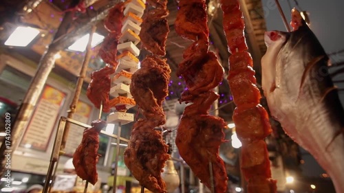Marinated Chicken pieces on a grill ready for cooking.